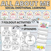 Educational materials for social-emotional learning with foldout activities and spinners on a wooden background.
